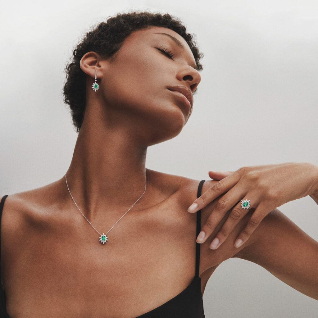 Model wearing Green Jay collection emeralds diamonds 18 kt white gold