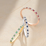 Anel de meia aliança Milett com diamantes e rubis em ouro rosa 18 K