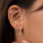 Pendiente Piercing Petite Diamonds Cross Mini en Oro Amarillo de 18 Kt